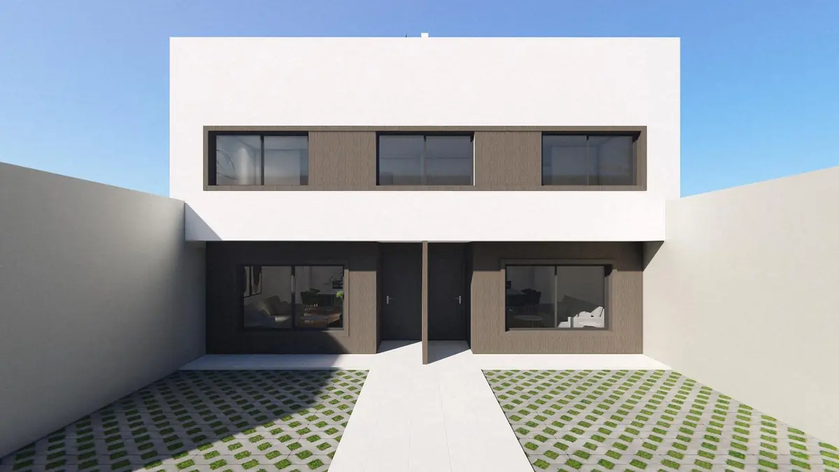 Frente de una casa moderna de dos plantas con jardín